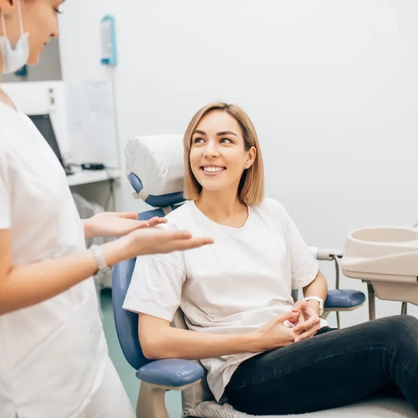 Dentist discussing treatment options with a smiling patient