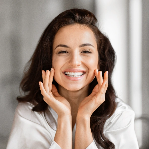 Woman smiling after Botox treatment for cosmetic dentistry