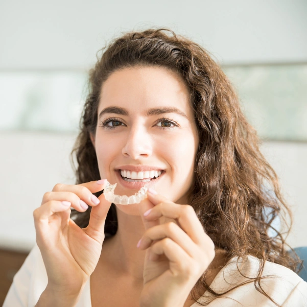 Patient wearing Invisalign clear aligners for teeth straightening