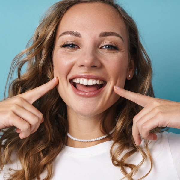 Patient showing brighter teeth after professional whitening