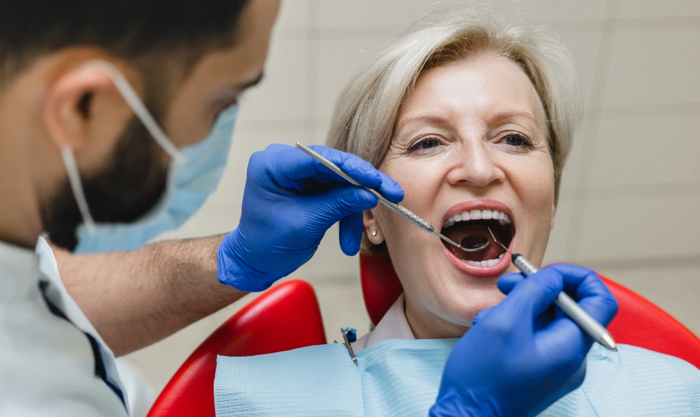 Dentist examining a patient during an emergency dental visit