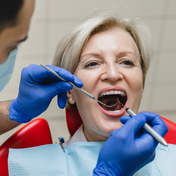 Patient receiving emergency dental care for severe tooth pain