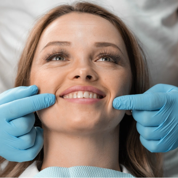 Dentist evaluating a patient's smile during a full mouth reconstruction consultation