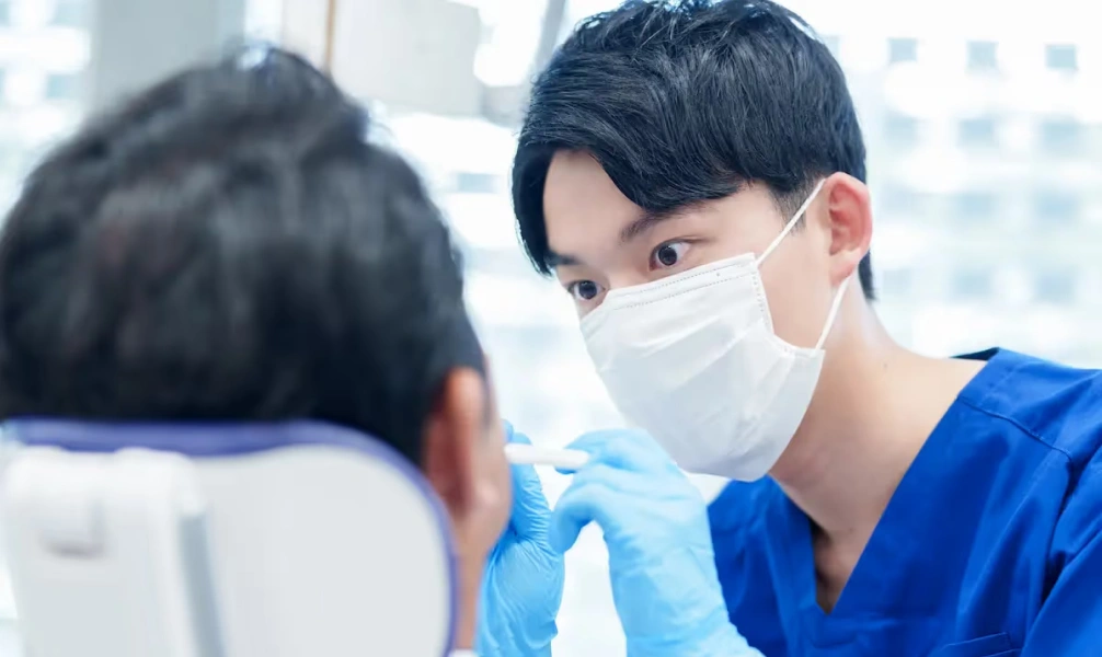 Dentist examining a patient during an emergency dental visit