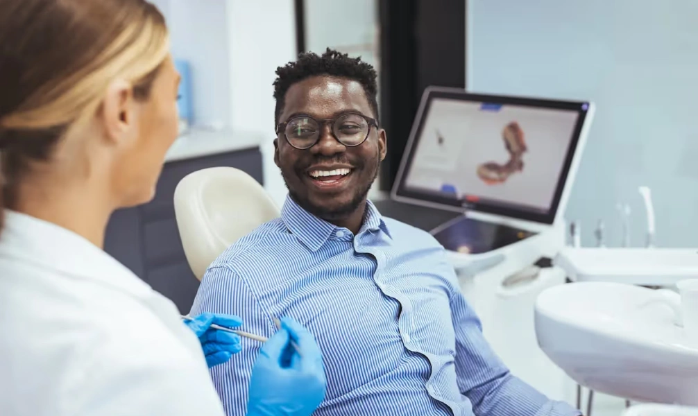 Dentist discussing treatment options with a patient