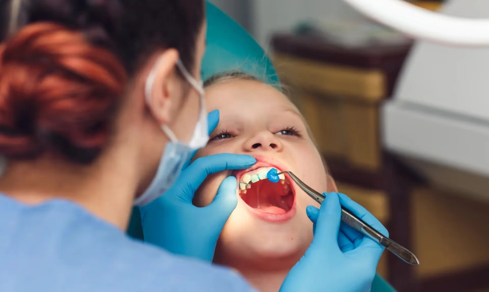 Child receiving a professional fluoride treatment