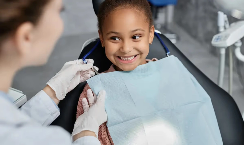 Smiling child during a pediatric dental appointment