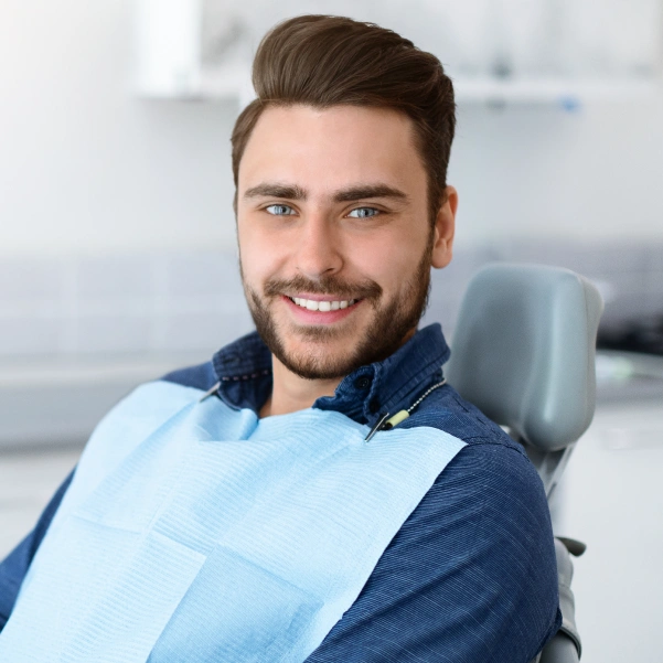 Smiling patient after an Icon resin treatment consultation