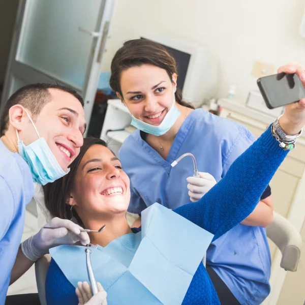 Dentist and patient taking a photo after a smile preview