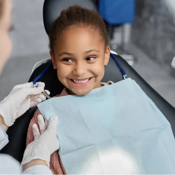 Young patient smiling during a pediatric dental visit