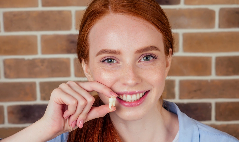 Woman smiling before a coronectomy consultation
