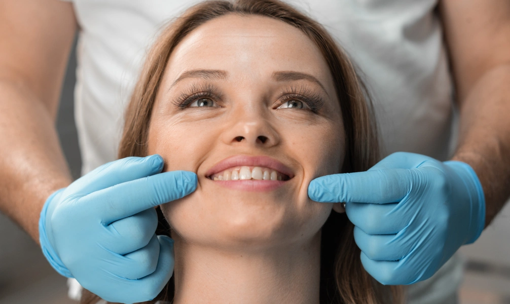 Dentist evaluating a patient's smile during a full mouth reconstruction consultation