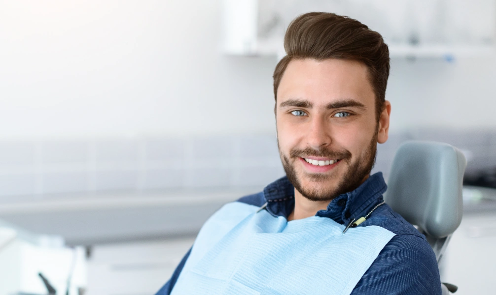 Smiling patient after an Icon resin treatment consultation