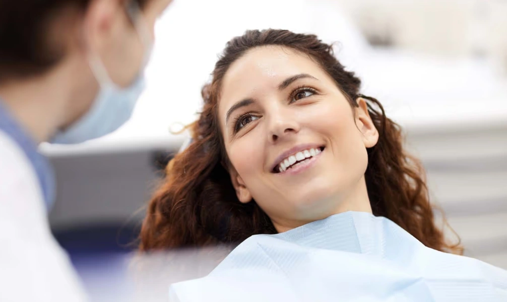 Patient smiling during an inlays and onlays consultation