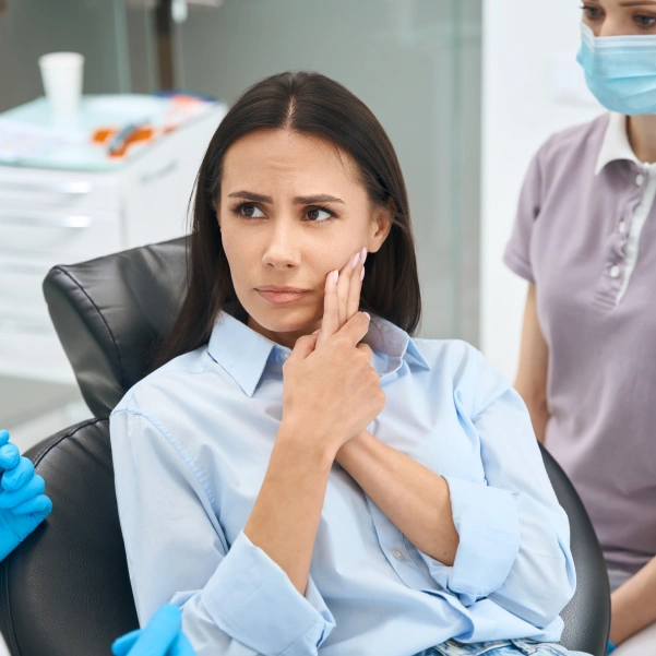 Patient discussing tooth pain during a root canal consultation