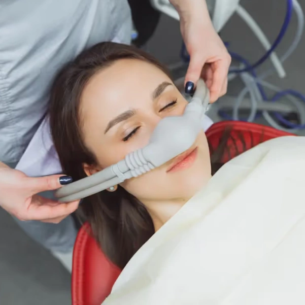Patient receiving comfortable sedation dentistry treatment