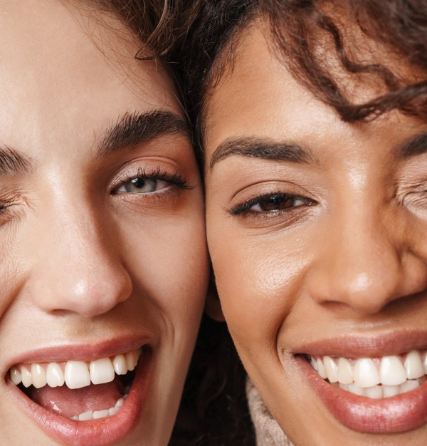 Happy patients smiling with healthy, bright smiles after dental care