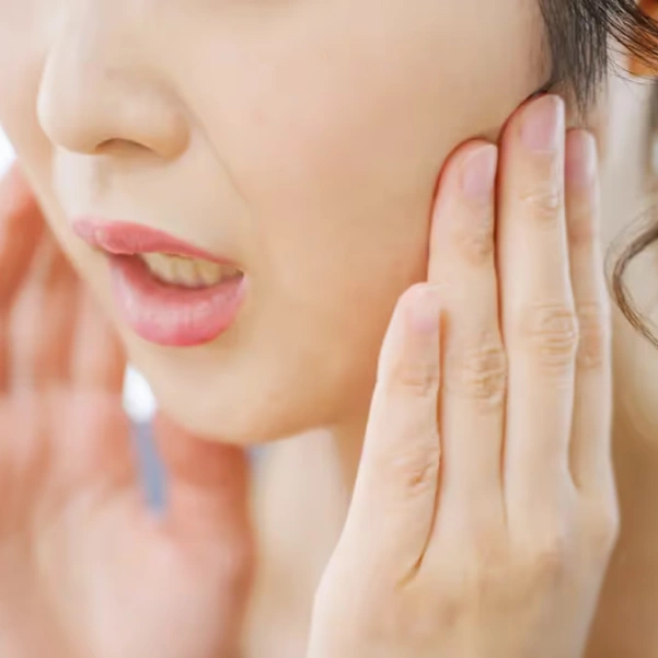 Patient experiencing relief with TMJ therapy treatment