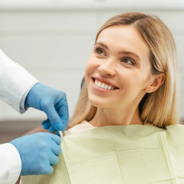 Dentist preparing a patient for a tooth extraction procedure